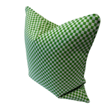 A square throw pillow featuring a green and grey checkerboard pattern, shown against a plain white background.