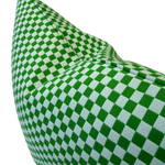 A close-up of a green and gray checkered fabric cushion or pillow corner on a plain white background.