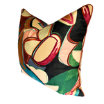 A square decorative throw pillow featuring an abstract, mid-century modern pattern with organic shapes in cream, green, pink, brown, and black.
