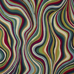 Abstract wavy patterned fabric with flowing vertical stripes in red, green, blue, beige, and dark navy tones.
