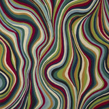 Abstract wavy patterned fabric with flowing vertical stripes in red, green, blue, beige, and dark navy tones.