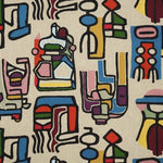 A close-up of a woven textile featuring an abstract, colorful geometric pattern on a light beige background.