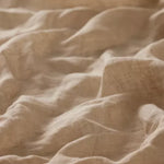 Linia Sheer Tiamo Honey beige fabric with a soft, textured weave and gentle folds.