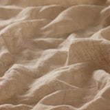 Linia Sheer Tiamo Honey beige fabric with a soft, textured weave and gentle folds.