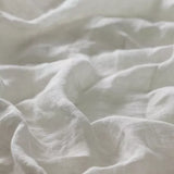 Linia Sheer Tiamo mist off-white fabric with a slightly textured, linen surface.