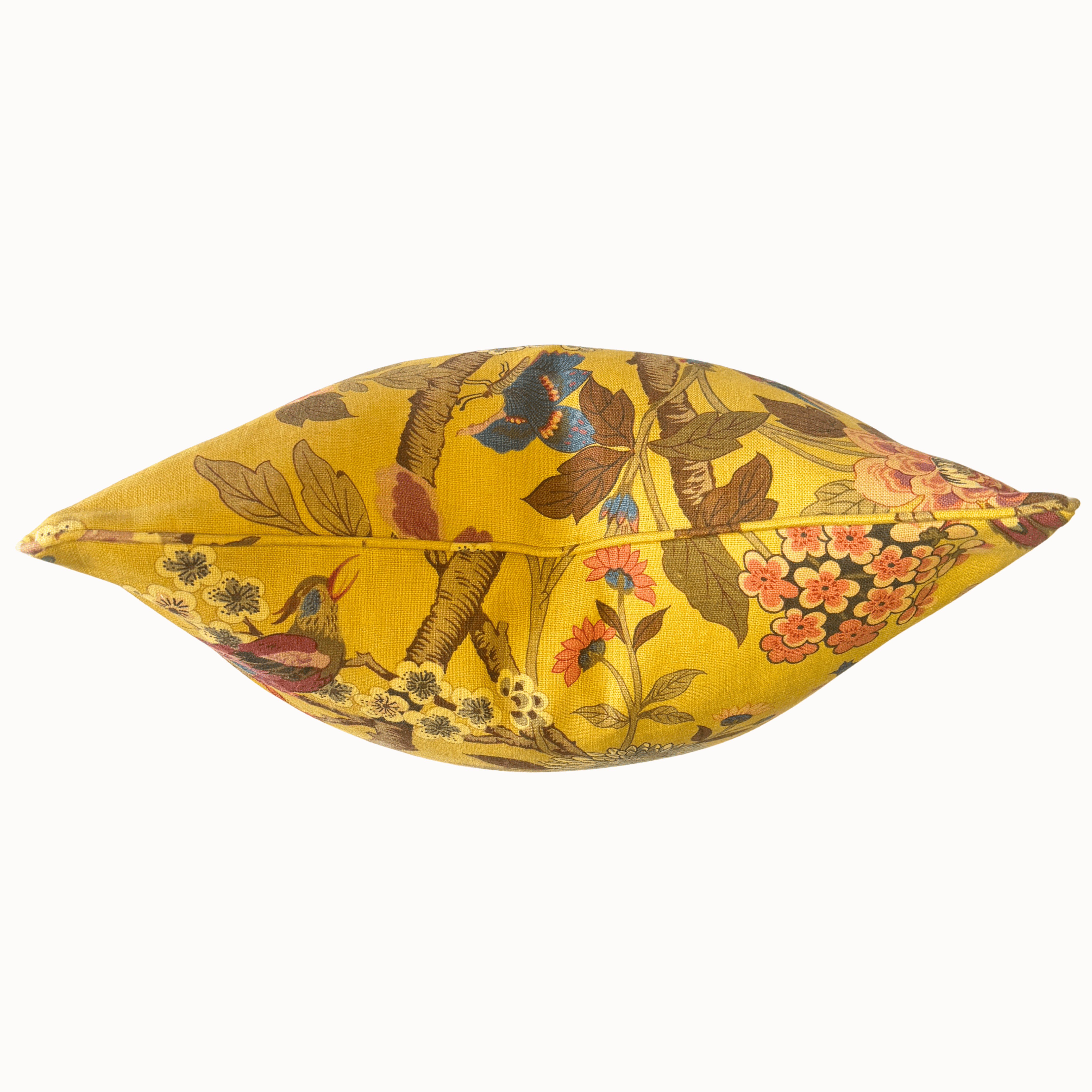 A decorative throw pillow featuring a vibrant yellow fabric printed with a detailed botanical and bird pattern, including a bluebird and pink flowers, set against a plain white background.