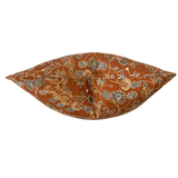 A square decorative throw pillow with a rust-orange background and a vintage-style floral pattern in muted blue-gray and gold, shown against a plain white background.