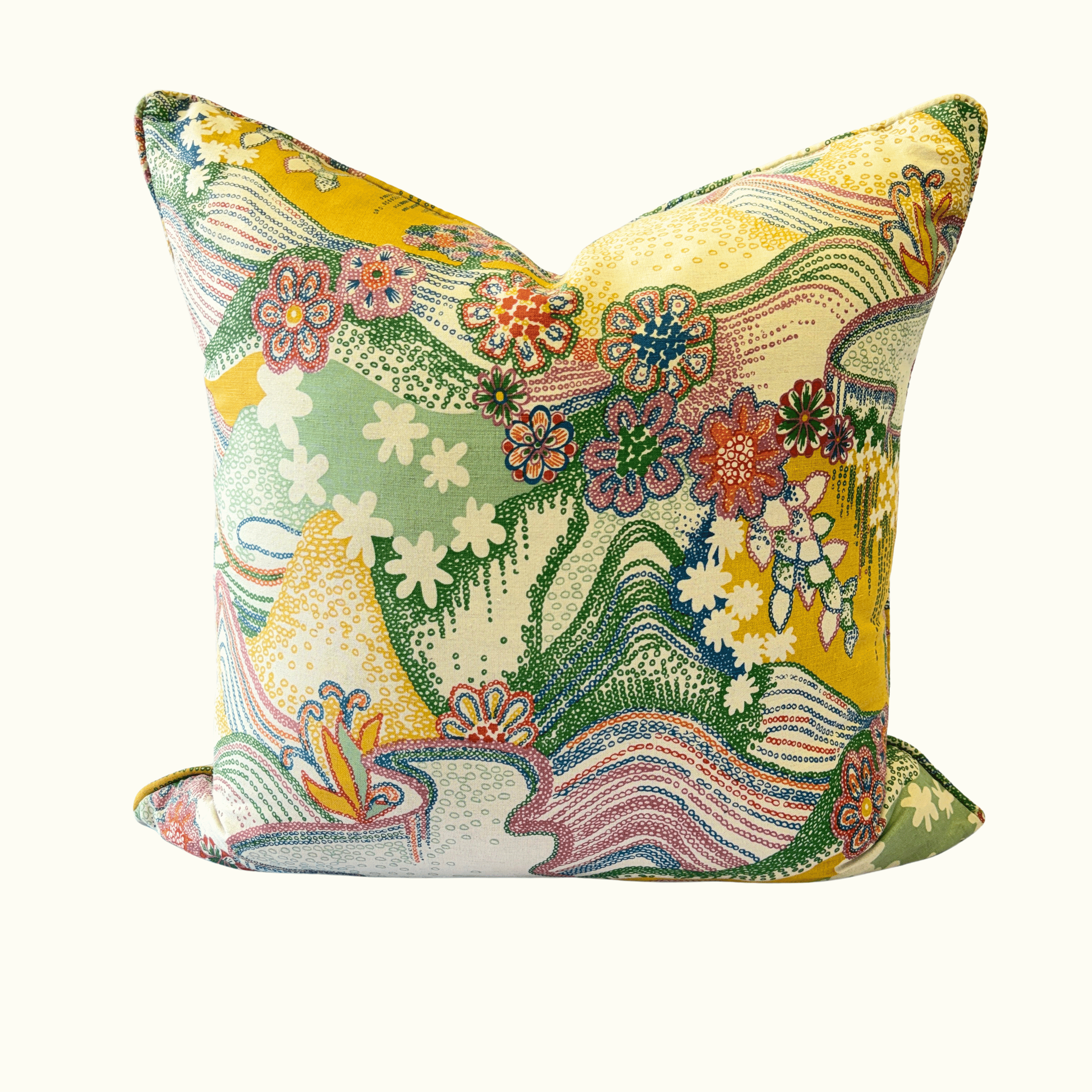 A square decorative throw pillow featuring a vibrant, multicolored retro-style landscape and floral pattern on a cream background.