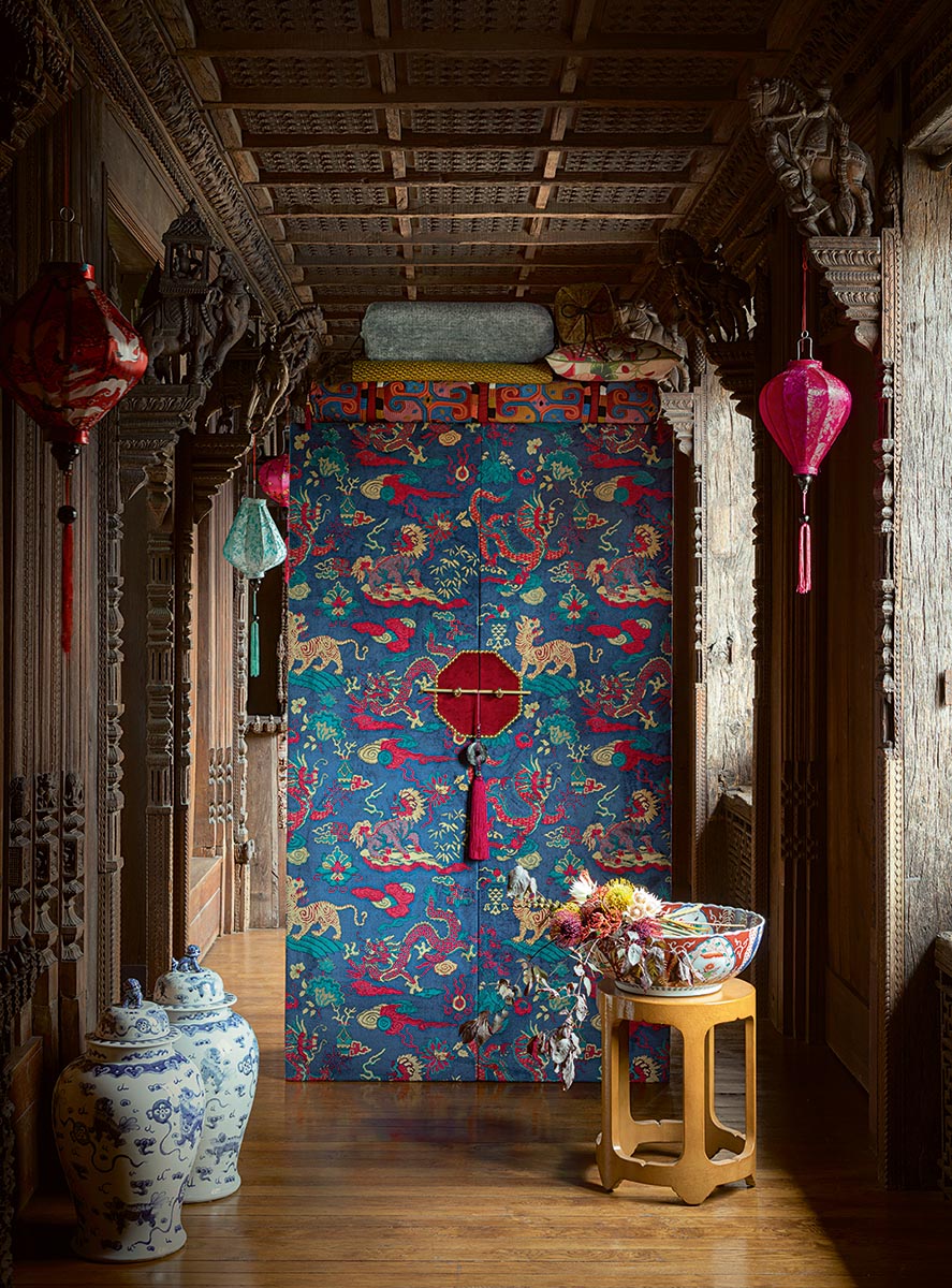 Decorative interior with a wanly upholstered doors lanterns, and traditional decor.