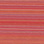 A close-up of a nimbin hibiscus textile with horizontal stripes in red, orange, pink, and purple tones.