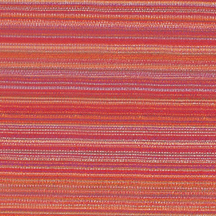 A close-up of a nimbin hibiscus textile with horizontal stripes in red, orange, pink, and purple tones.